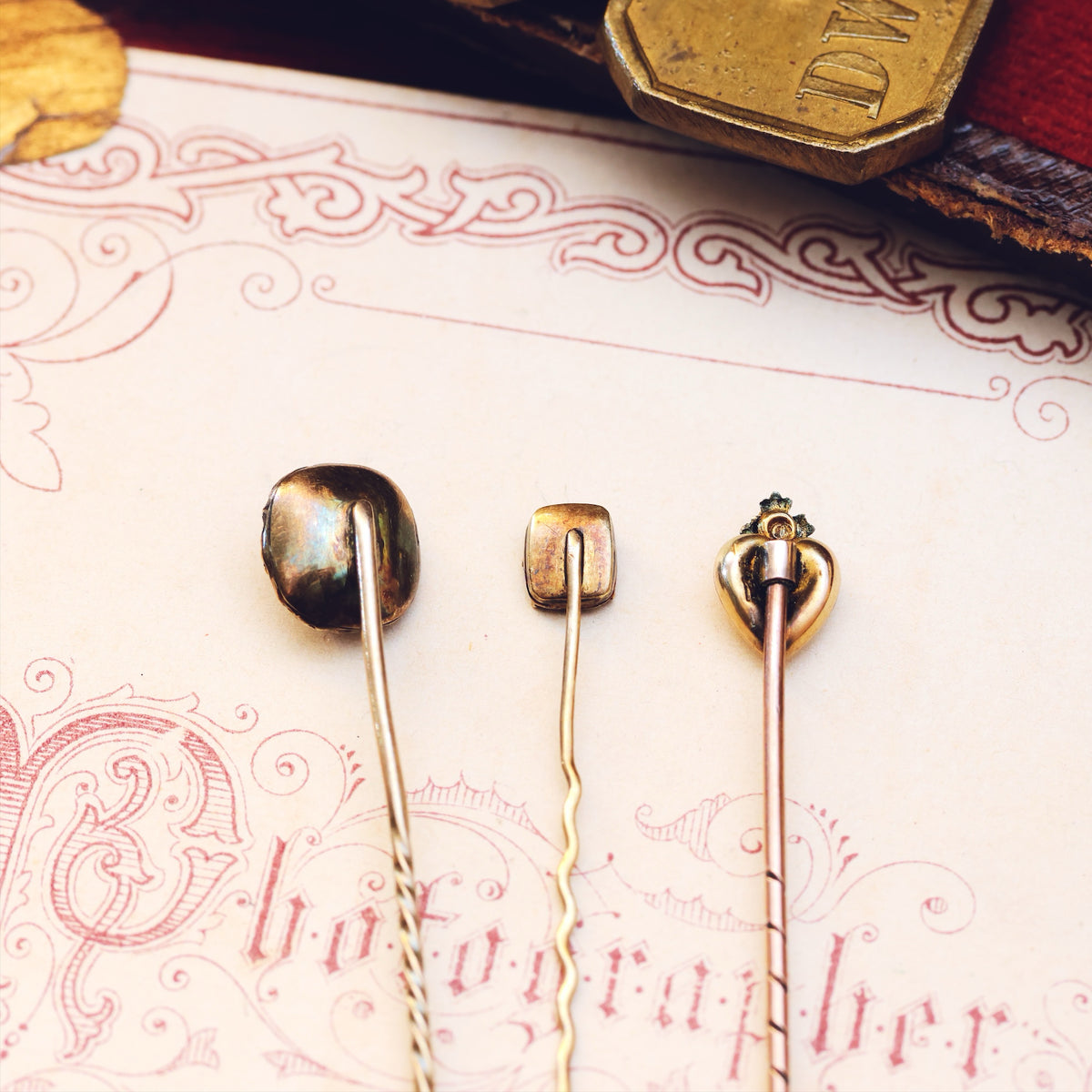 A Trio of Miniature Antique Stick Pins